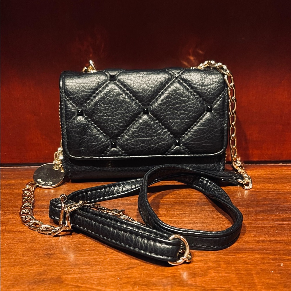 Deux lux black quilted crossbody wallet with gold chain and black leather strap.